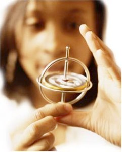 a woman holding an antique compass