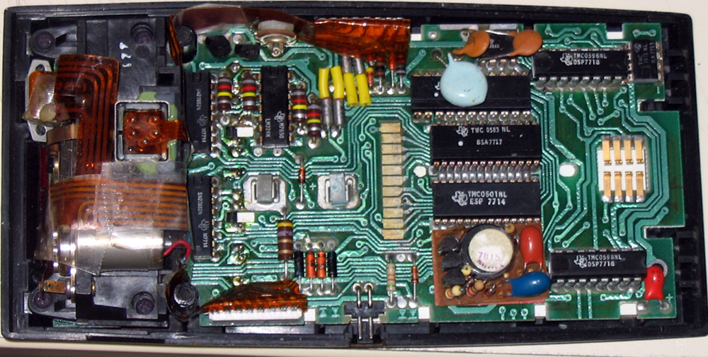 In an electronic calculator circuit the memory is preserved using large capacitors which store energy when the batteries are charged.