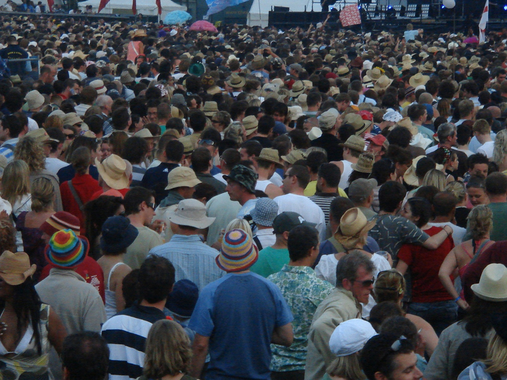 A crowd of people all facing in one direction.