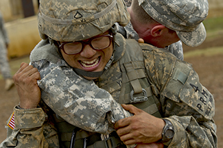 A photograph shows two soldiers physically fighting.