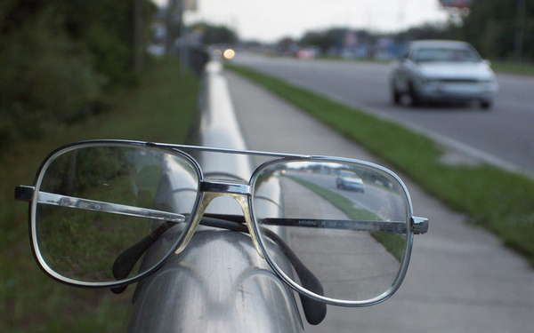 A car when viewed through a concave lens looks upright.