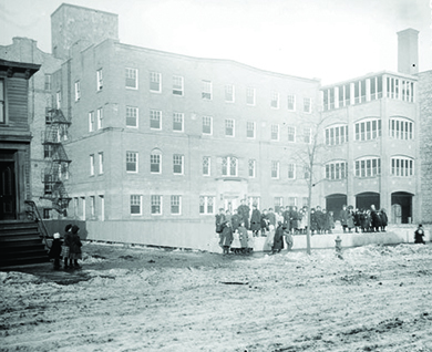 A photograph shows Hull House in Chicago.