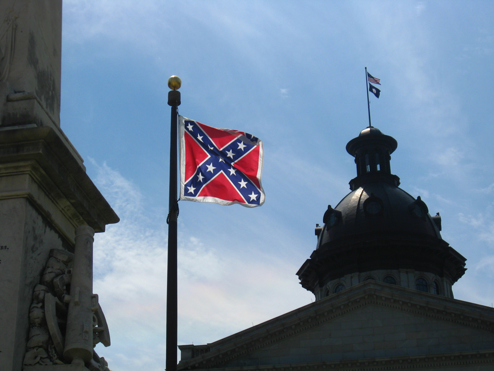 A photo of the Confederate flag hanging on a flagpole