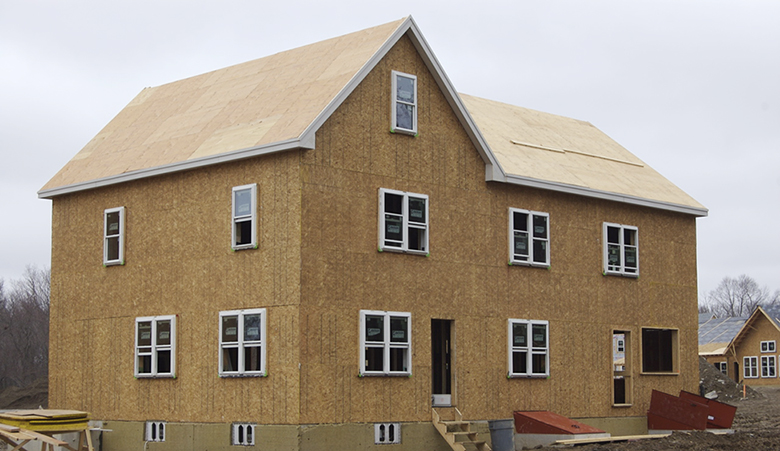 This photograph shows a new house under construction.