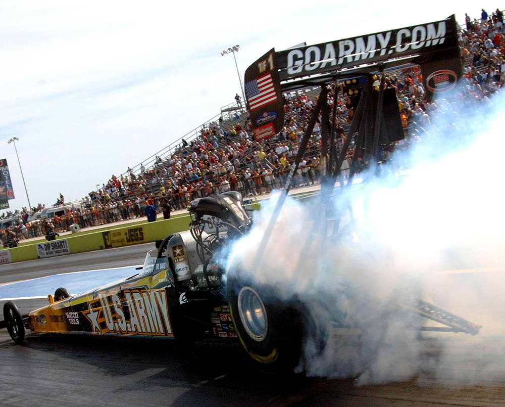 Dragster accelerating down a race track.