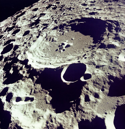 Photograph of Lunar Highlands. This image is dominated by countless overlapping craters of all sizes, which is typical of the Lunar highlands.