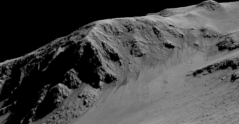 Flowing water on Mars? Between the steep, rugged terrain of the crater wall (seen from the lower left to the upper right in this image) and the smooth ground on the lower right, dark streaks can be seen emanating from the base of the steep ground and moving down-slope toward the bottom of the frame.