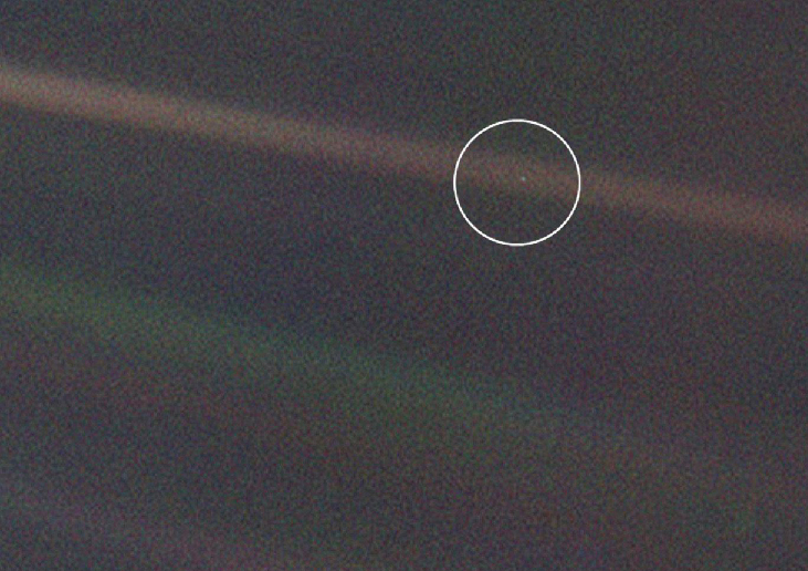 Earth from 4 billion miles. The Earth (circled) appears as a mere speck of light in this Voyager image. No signs of life, or any surface features at all, are evident.