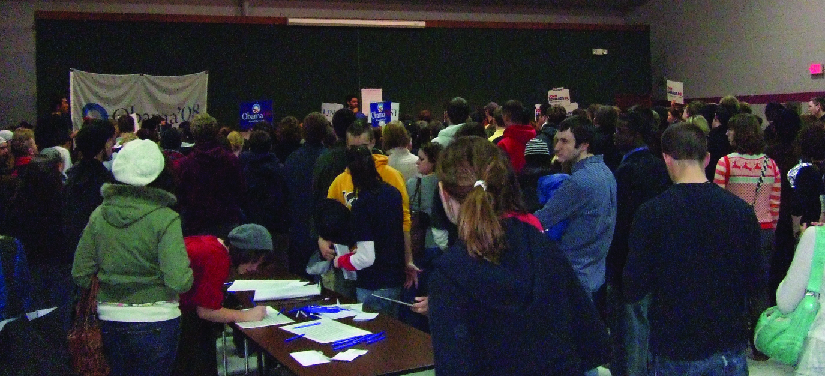 An image of a group of people standing in a room.